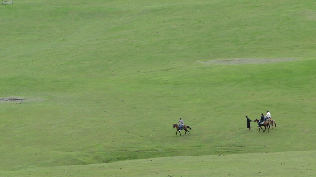 Pony riding across Doodhpathri meadows in Kashmir